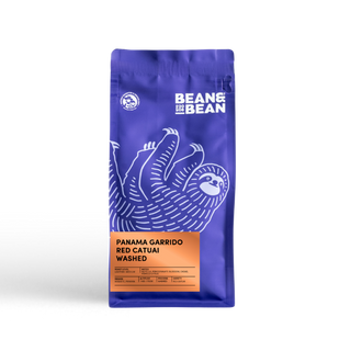 Purple coffee bag with a sloth, orange label—Panama Gissell Garrido by Bean & Bean Coffee Roasters.
