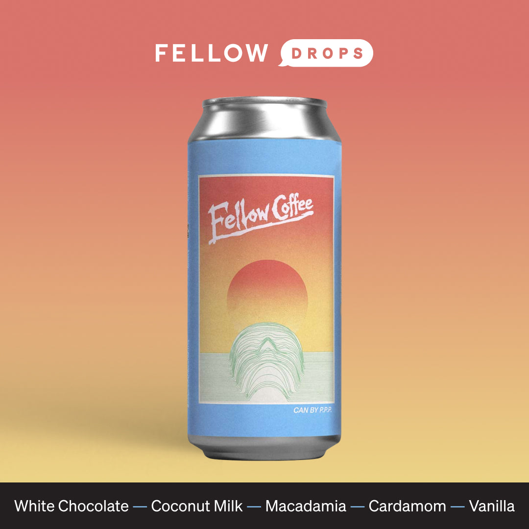 A Fellow Elysium coffee can with a sunset design, labeled with brand and flavor notes.