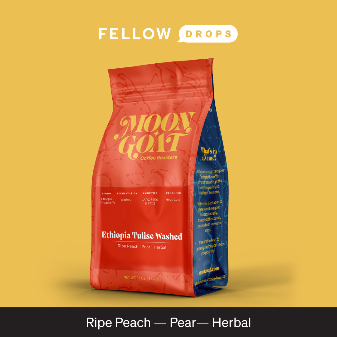 A red M2D2 LLC Ethiopia Tulise Washed coffee bag on a yellow background.