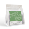 White coffee bag labeled Driftaway Coffee Cardamom Cloud, a Colombian coffee.