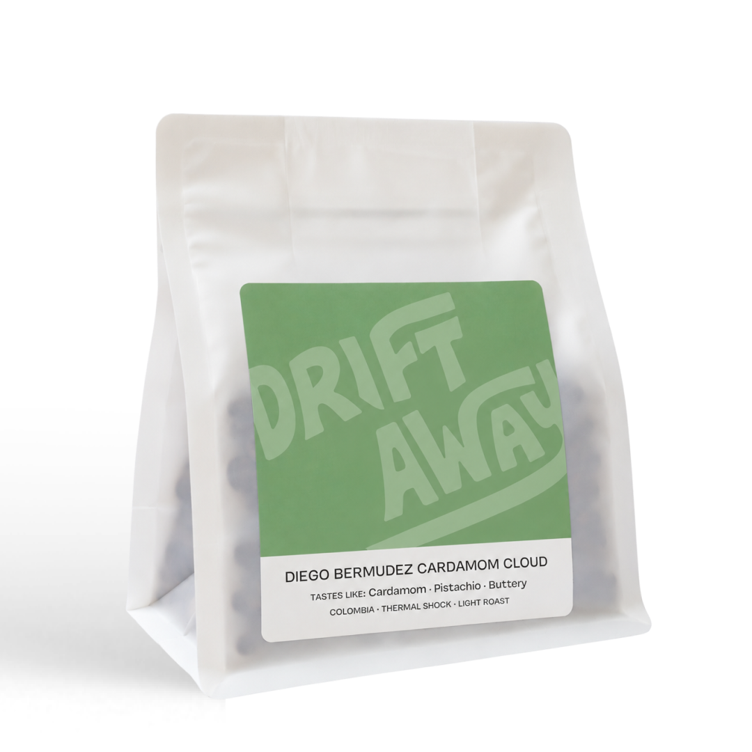 White coffee bag labeled Driftaway Coffee Cardamom Cloud, a Colombian coffee.