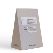 Grey coffee bag labeled stereoscope Colombia - Finca El Diviso - Estate with tasting notes.