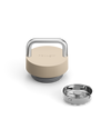 Fellow The Carry Lid in beige and silver with handle, shown beside stainless steel base insert.