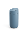 Fellow Carter Slide Mug in matte blue with rounded shape and matching lid, on white background.