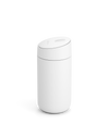 The Fellow Carter Slide Mug is a minimalist white cylinder with a rounded, slightly tilted lid.