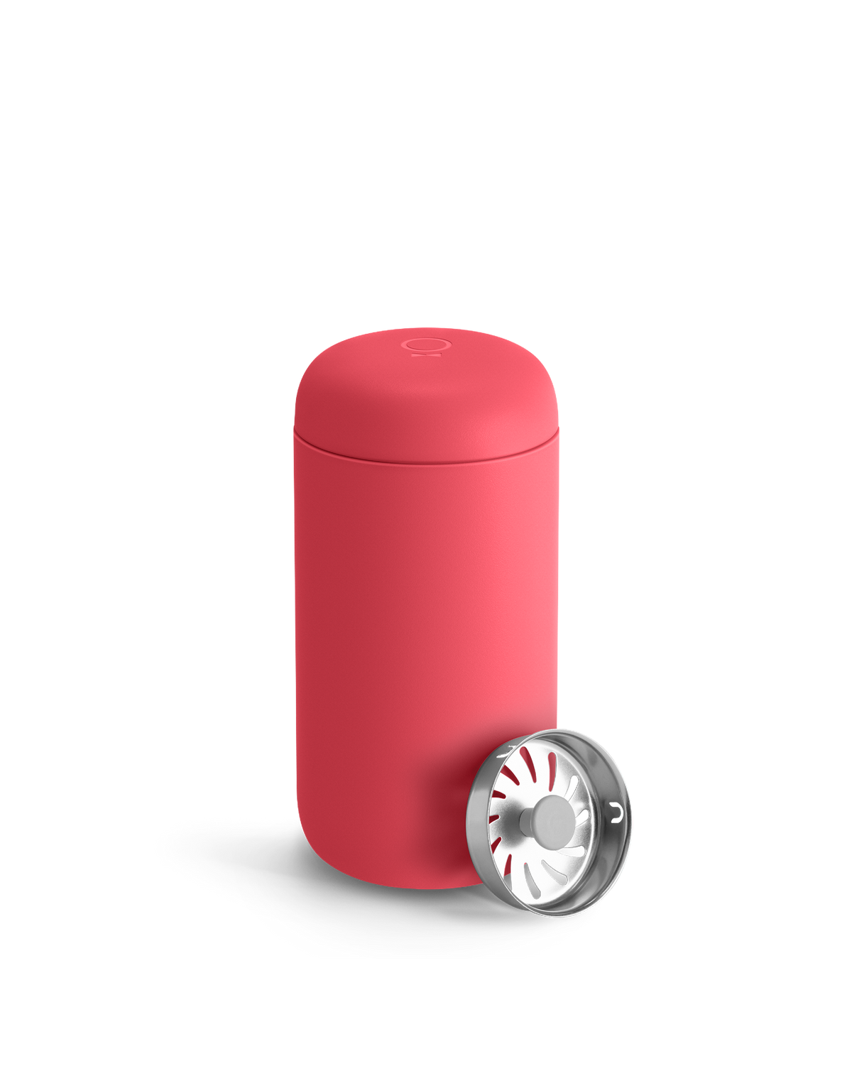 A Coral Crush Fellow Carter Move Mug with a metallic lid sits in front.