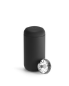 Matte black Fellow Carter Move Mug with rounded lid and separate metal strainer cap.