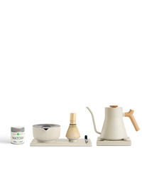 A Fellow The Kettle + Matcha Kit including a bowl, strainer, whisk, and gooseneck electric kettle.