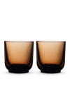 Two brown Pirch Espresso Glasses by Fellow with a modern design on a white background.
