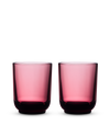 Two Fellow Pirch Espresso Glasses in pink displayed on a white background.