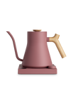 Fellow Stagg EKG Electric Kettle in pink, quick heat, wooden handle, and matching base.