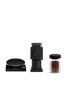 Fellow’s The Weigh To Go Kit: scale, grinder, and canister of beans on a white background.