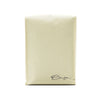 A beige Monarch bag by Onyx Coffee Lab with a small cursive logo and dark chocolate coffee notes.