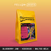 A yellow bag of Sightseer Coffee's Space Cowboy with colorful astronaut art.