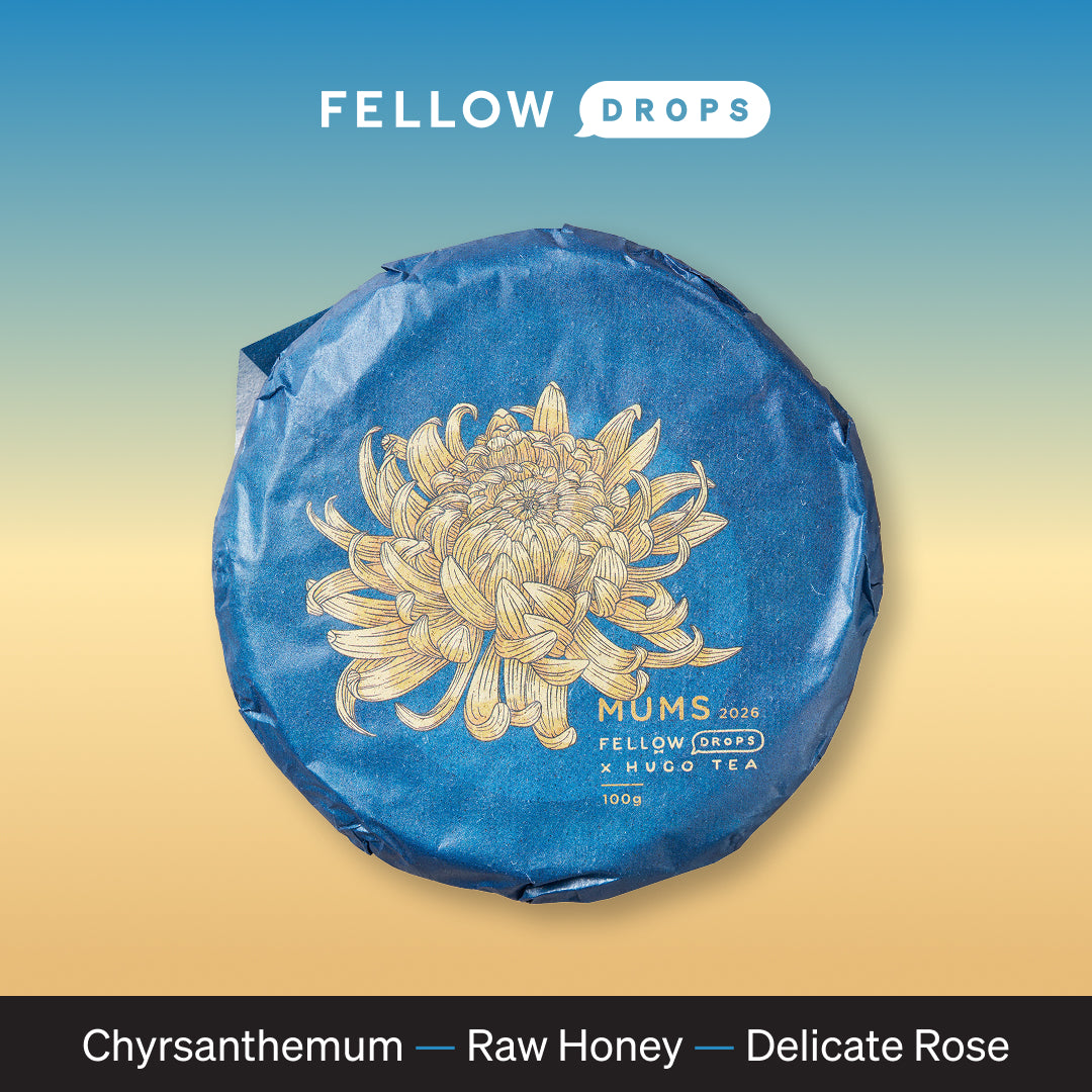 Round blue tea tin with gold chrysanthemum, labeled MUMS by Hugo Tea Company.