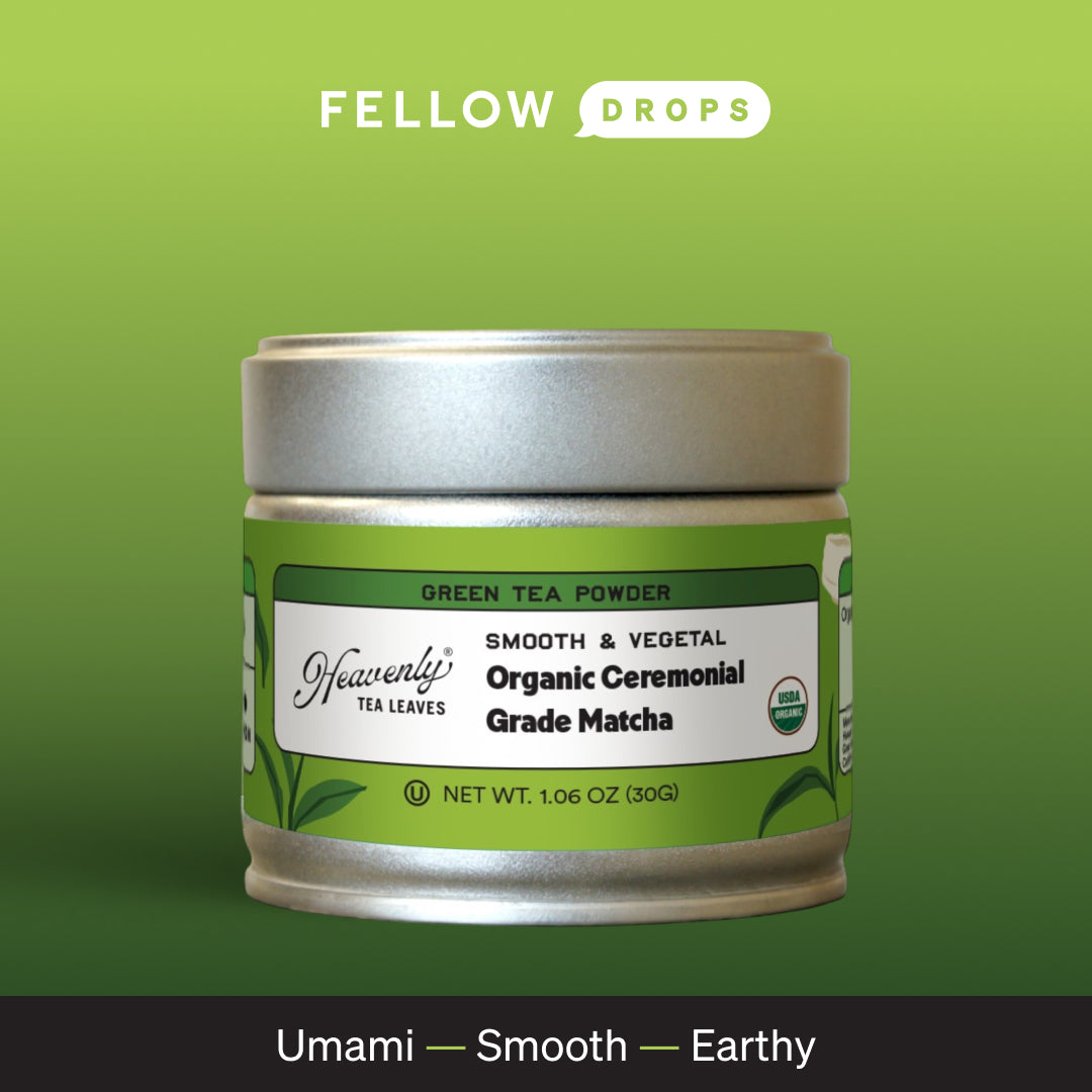 A tin of Heavenly Tea Leaves Organic Ceremonial Grade Matcha on a green gradient background.