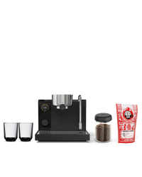 Fellow Father's Day Bundle: black espresso machine, two cups, coffee beans, espresso blend.