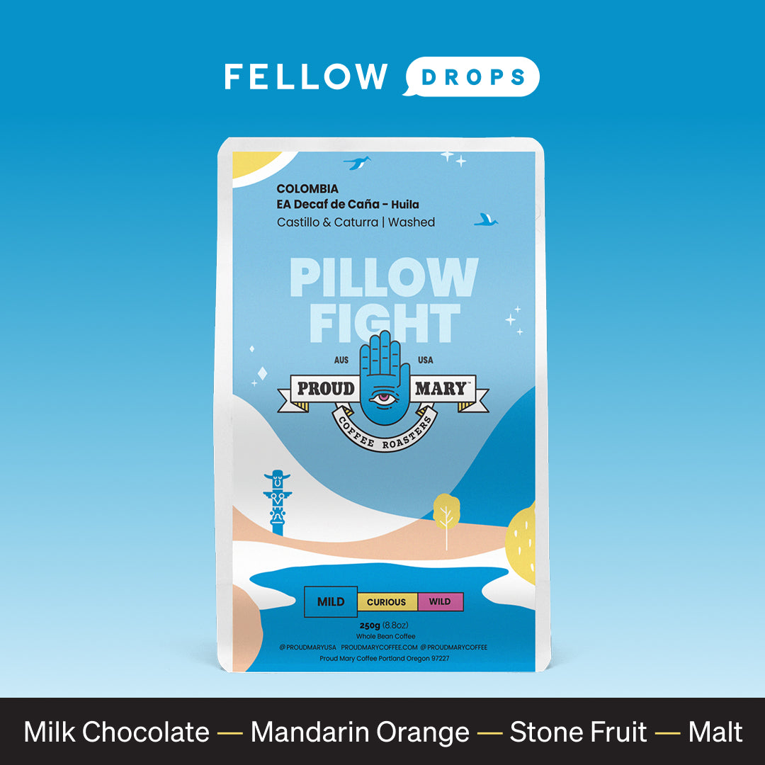 A blue bag of Proud Mary Coffee’s Decaf de Caña Pillow Fight with chocolate, fruit, and malt notes.