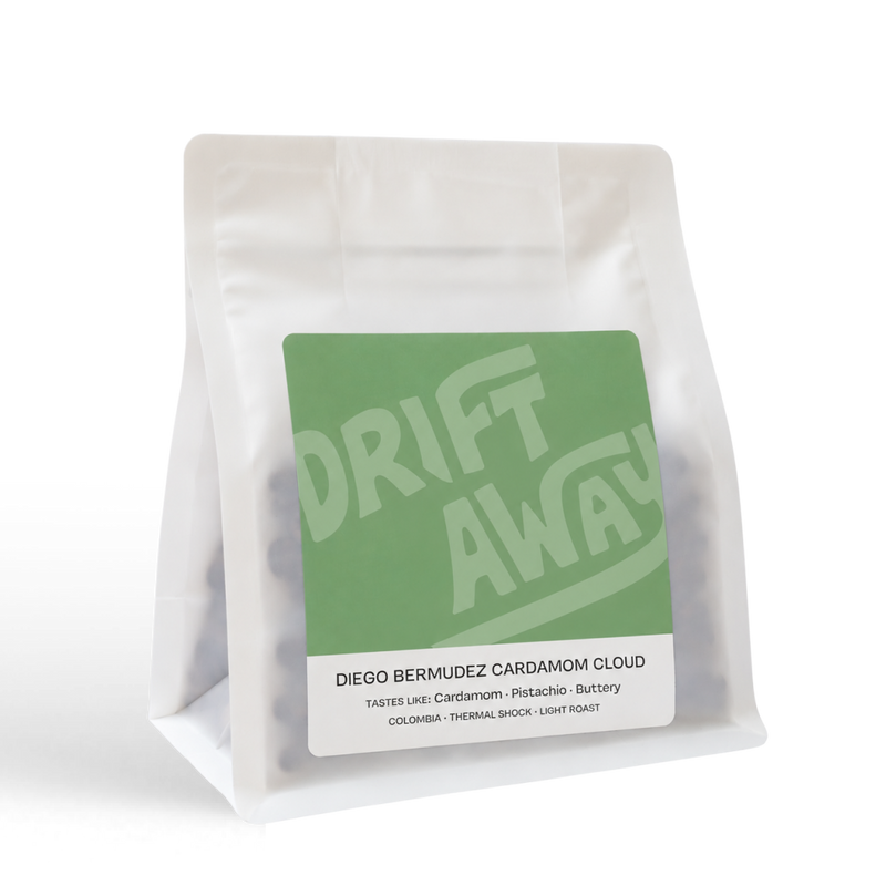 White coffee bag labeled Driftaway Coffee Cardamom Cloud, a Colombian coffee.
