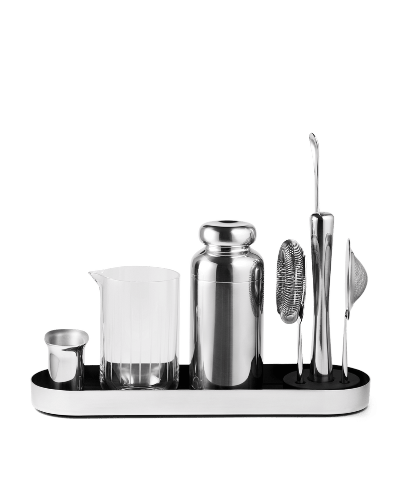 Fellow Mixology Set with a stainless steel cocktail shaker, mixing glass, and bar tools on a tray.