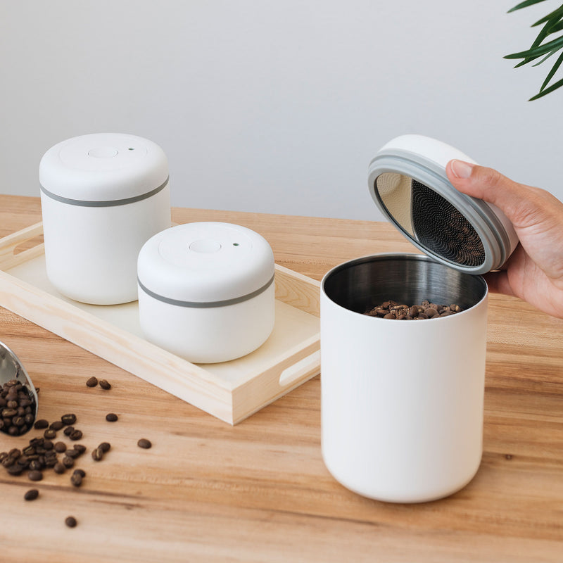 All sizes of clear Atmos Vacuum Canister in Matte White. Opening Large Atmos to get coffee beans.