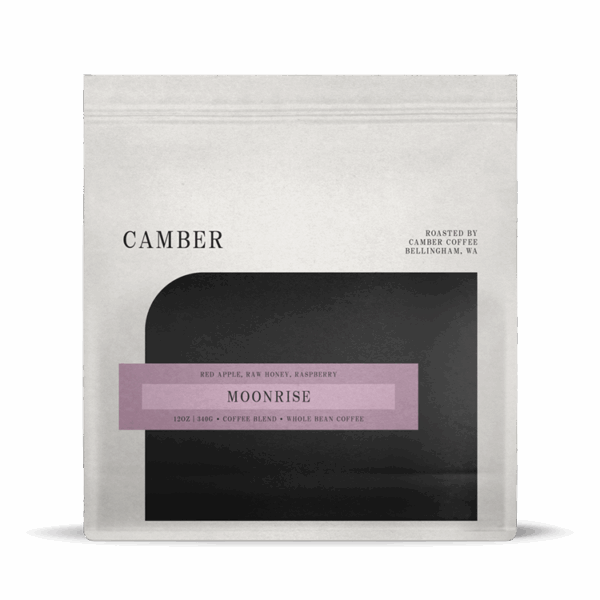 White coffee bag labeled CC Moonrise, ideal for espresso. Black and purple design.