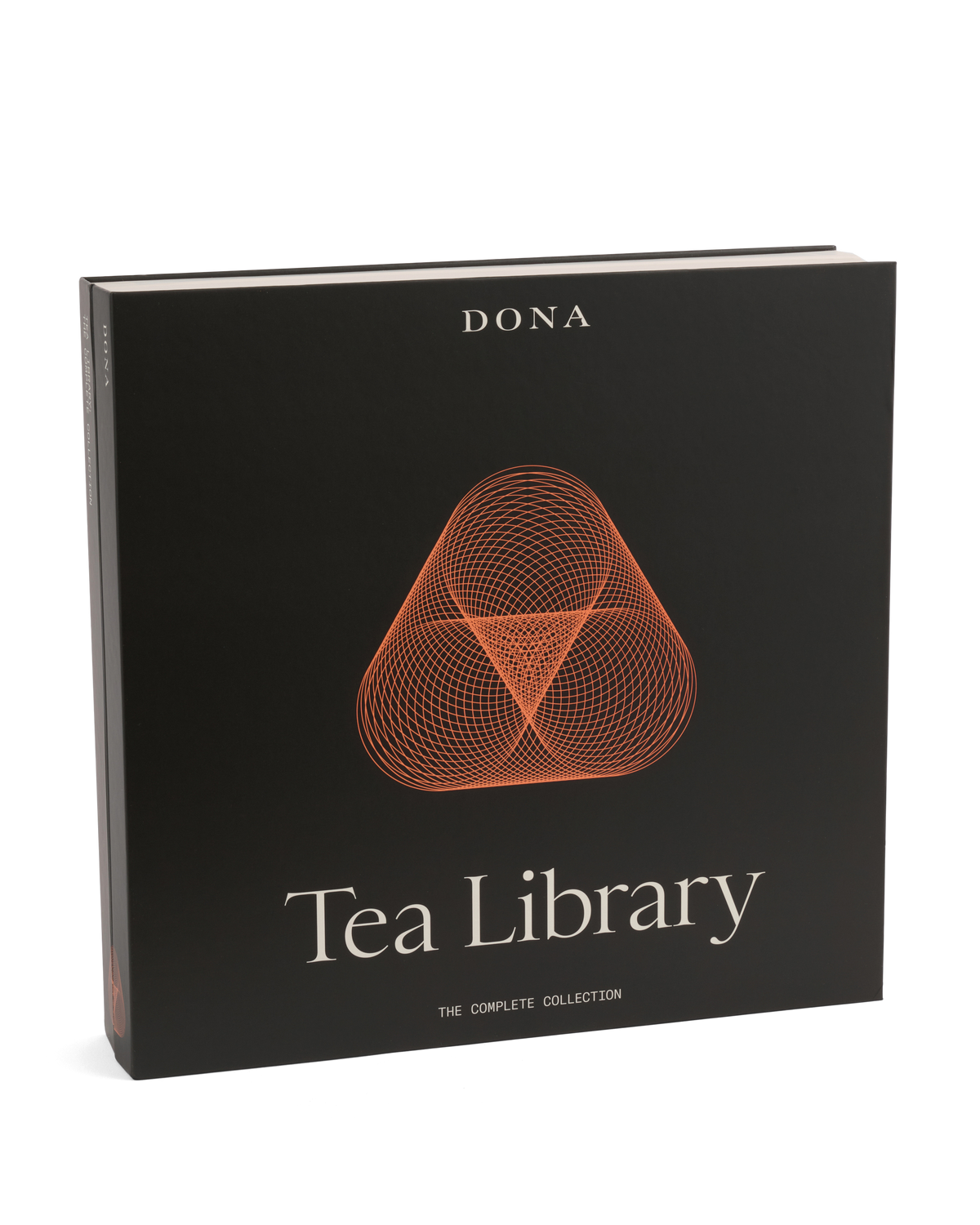 Black square Dona Tea Library box with an orange geometric graphic, holding Assam and oolong tea.