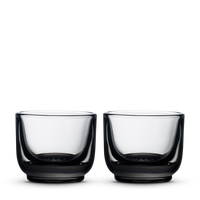 Two Fellow Pirch espresso glasses in smoke color on a plain white background. - media thumbnail