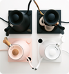 four stagg ekg kettles in black, copper, pink, and white 