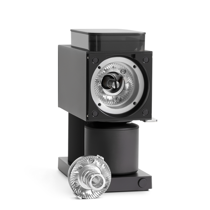 A black coffee grinder with a removable silver burr, perfect for any home barista.