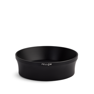 Fellow Espresso 58 mm Magnetic Dosing Funnel, black and round with logo on the side.