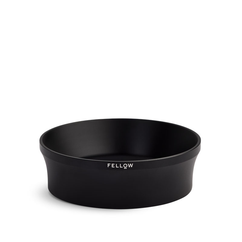 Fellow Espresso 58 mm Magnetic Dosing Funnel, black and round with logo on the side.