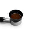 Fellow Espresso 58 mm Magnetic Dosing Funnel fits 58 mm portafilters; shown with coffee grounds.