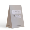 Grey coffee bag labeled stereoscope Colombia - Finca El Diviso - Estate with tasting notes.