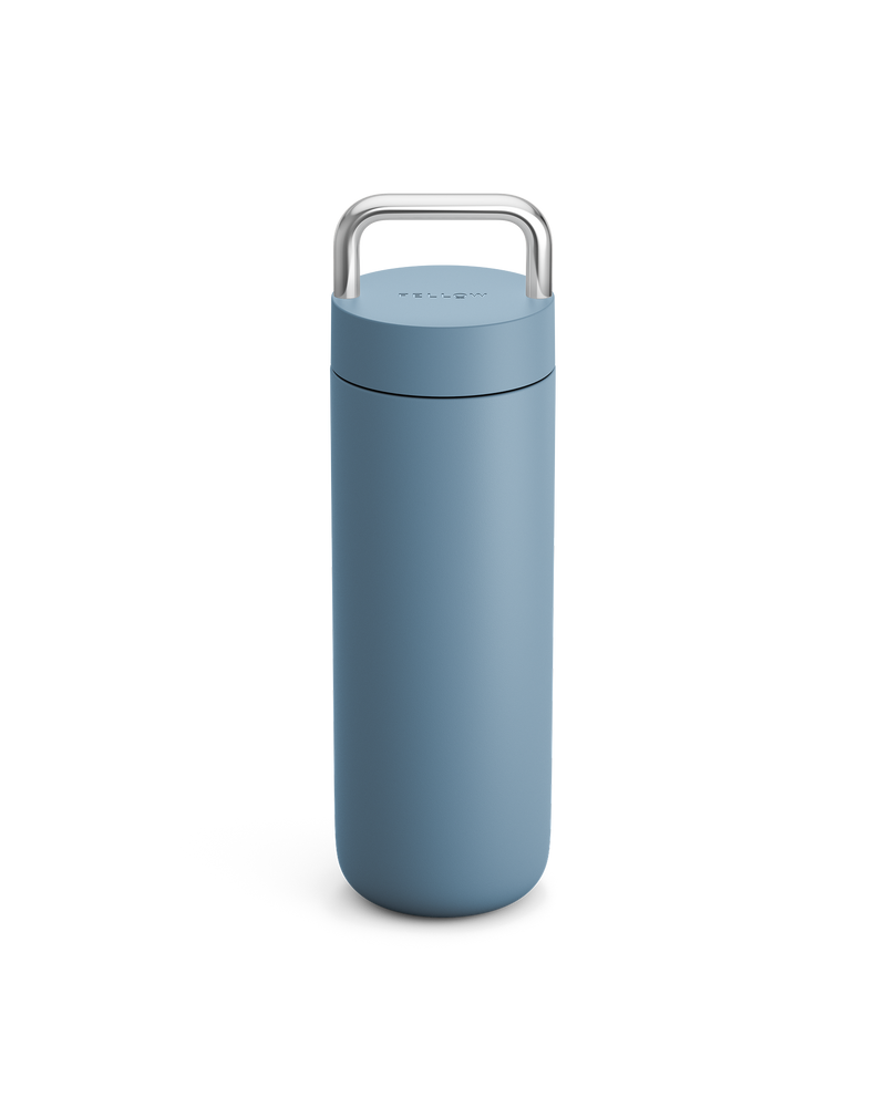 Fellow Carter Carry Travel Mug in Hazy Blue with a metal handle on a white background.