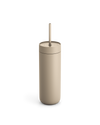 Fellow Carter Cold Tumbler in matte beige with lid and straw on a white background.
