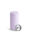 A light purple Fellow Carter Move Mug with a metal strainer leaning against it.