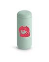 Light green Fellow Carter Move Mug with a pink frog holding a teacup on the front.