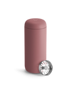 Fellow Carter Move Mug—matte pink with metal strainer, ideal travel mug on white background.