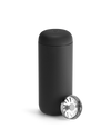 A matte black Fellow Carter Move Mug paired with a metal strainer lid.