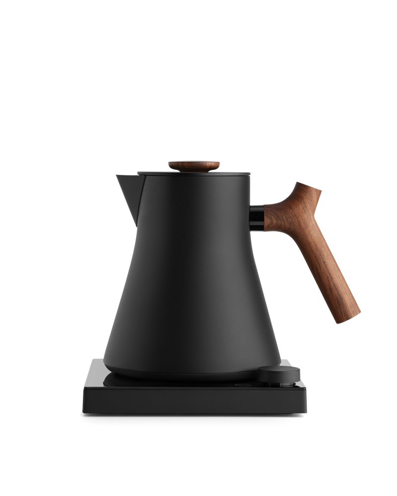 Fellow Rebrew Corvo EKG Pro Studio Edition electric kettle in matte black with wood handle.