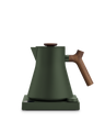 Fellow Corvo EKG Electric Kettle in matte green with wooden handle on a matching base.