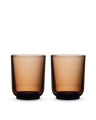 Two Fellow Pirch Espresso Glasses in amber sit on a white background.