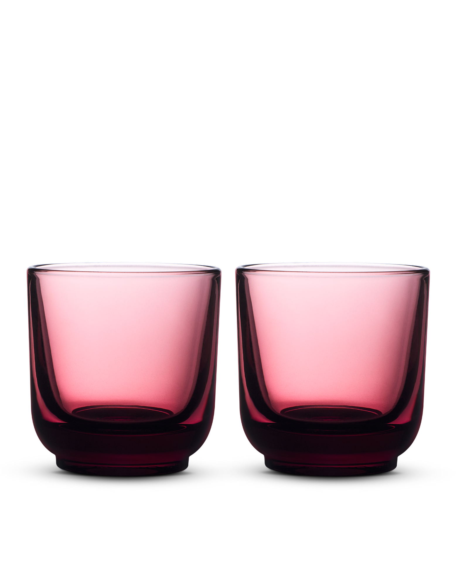 Two rounded, transparent Pirch Espresso Glasses by Fellow on a white background.