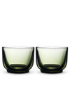 Two Pirch Espresso Glasses by Fellow with rounded bottoms sit side by side on white.