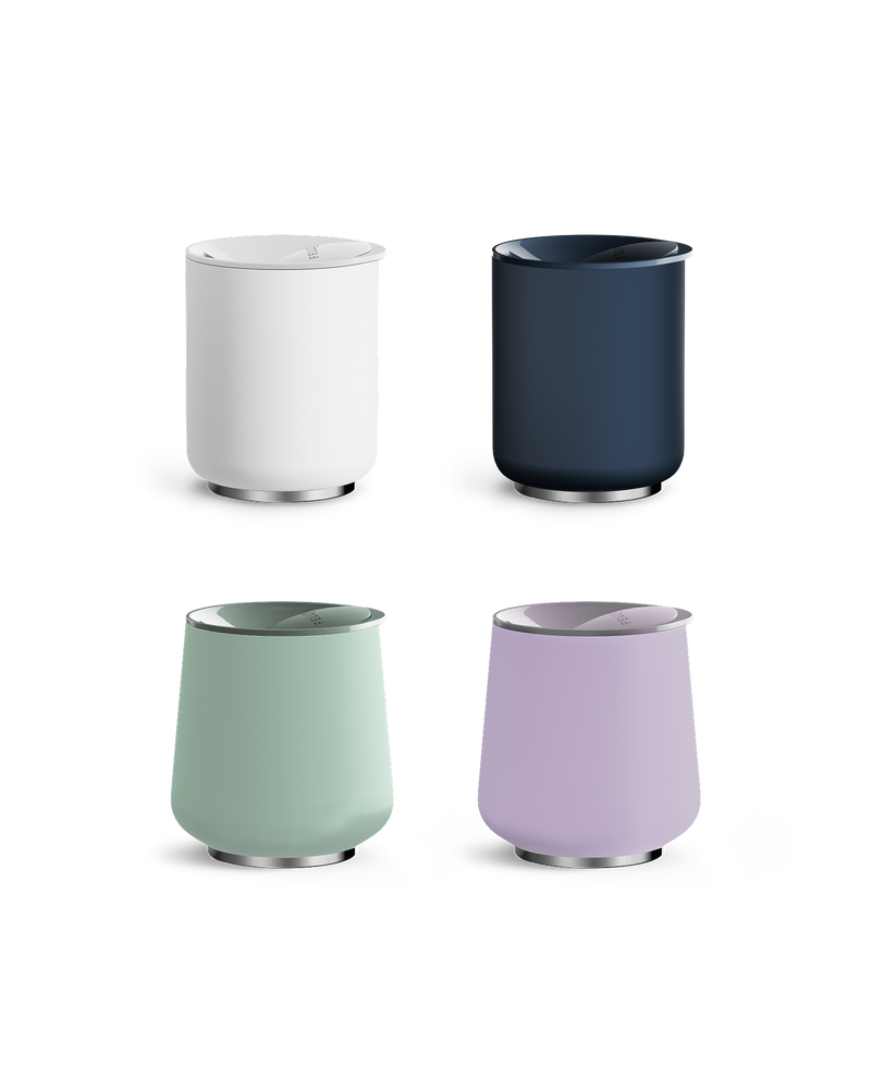 Four modern Fellow Stiff Drink Set tumblers in white, navy, mint green, and lavender.