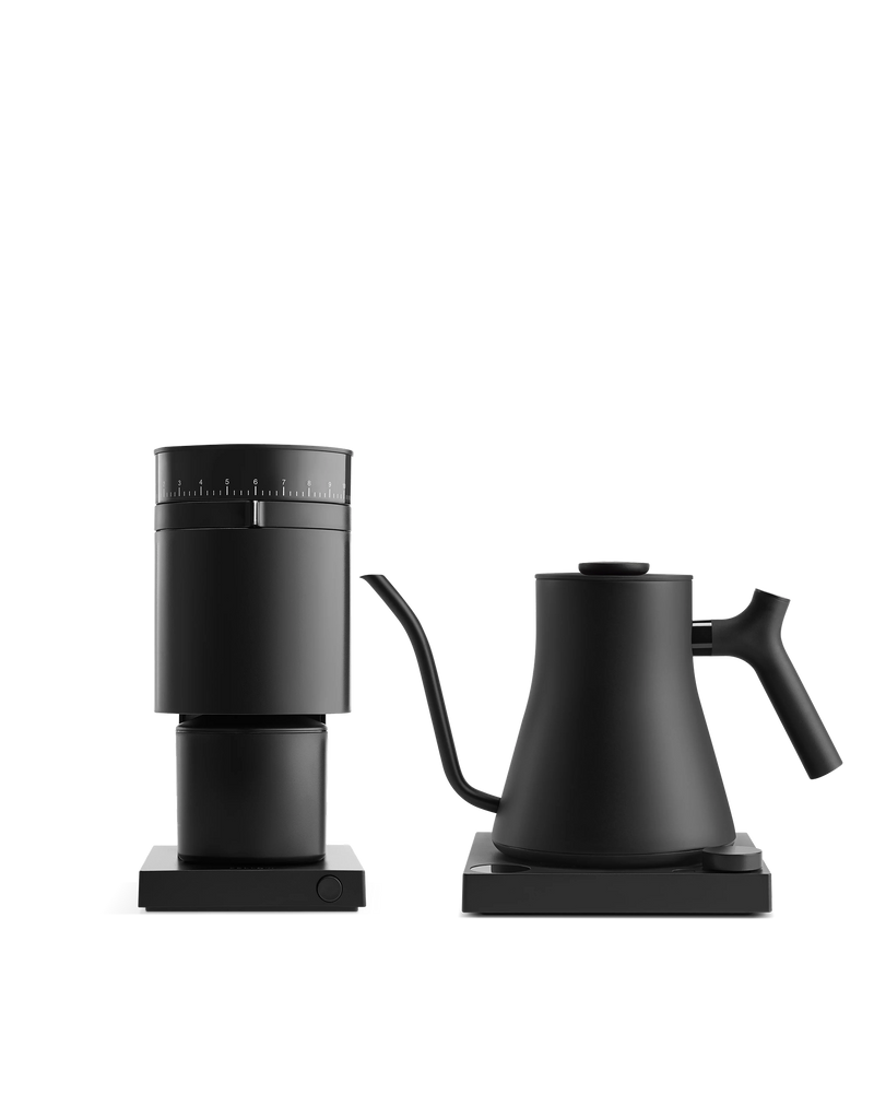 Fellow's The Electric Kit: sleek black grinder and kettle on square bases, white background.