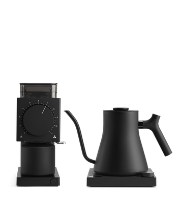 Fellow's The Electric Kit: sleek black kettle and grinder for home baristas, white background.