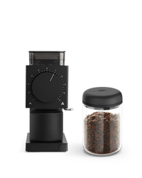 The Fellow Grind It Kit: a black coffee grinder with an airtight container for fresh beans.