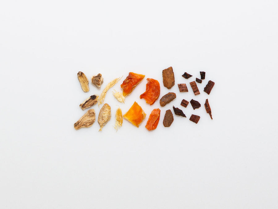 Carrot blend by Song Tea & Ceramics, dry herbs and fruit pieces on a white background. - media